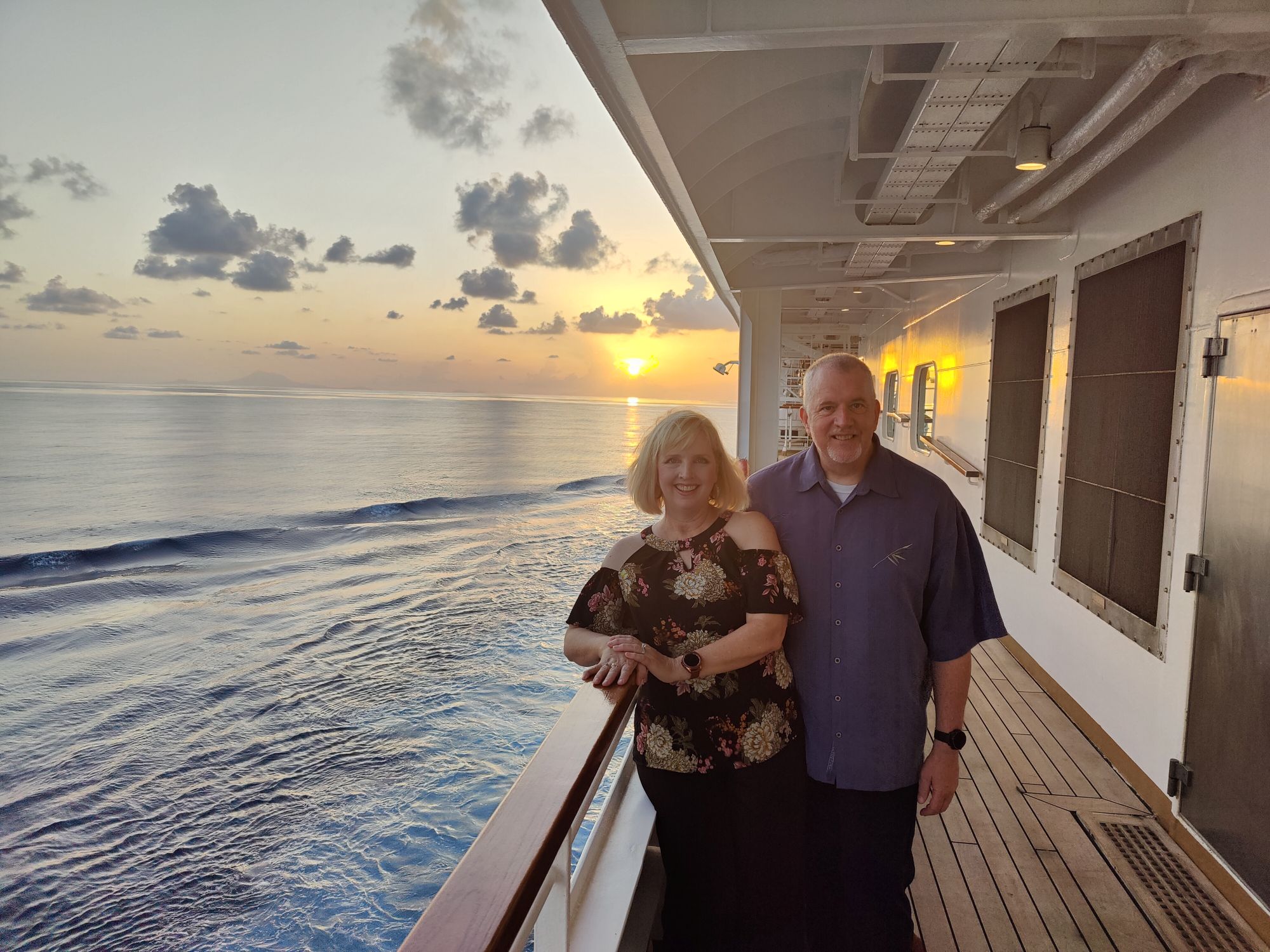 Suzanne and Steve aboard a cruise ship at sunset